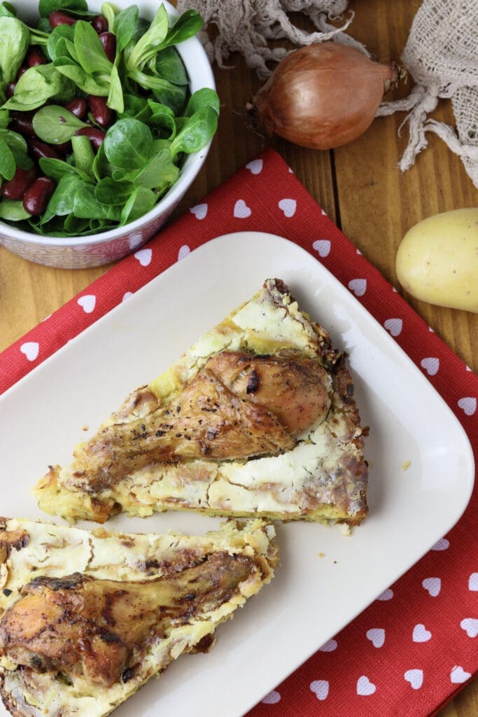 kljukusa served on a plate with salads and an onion